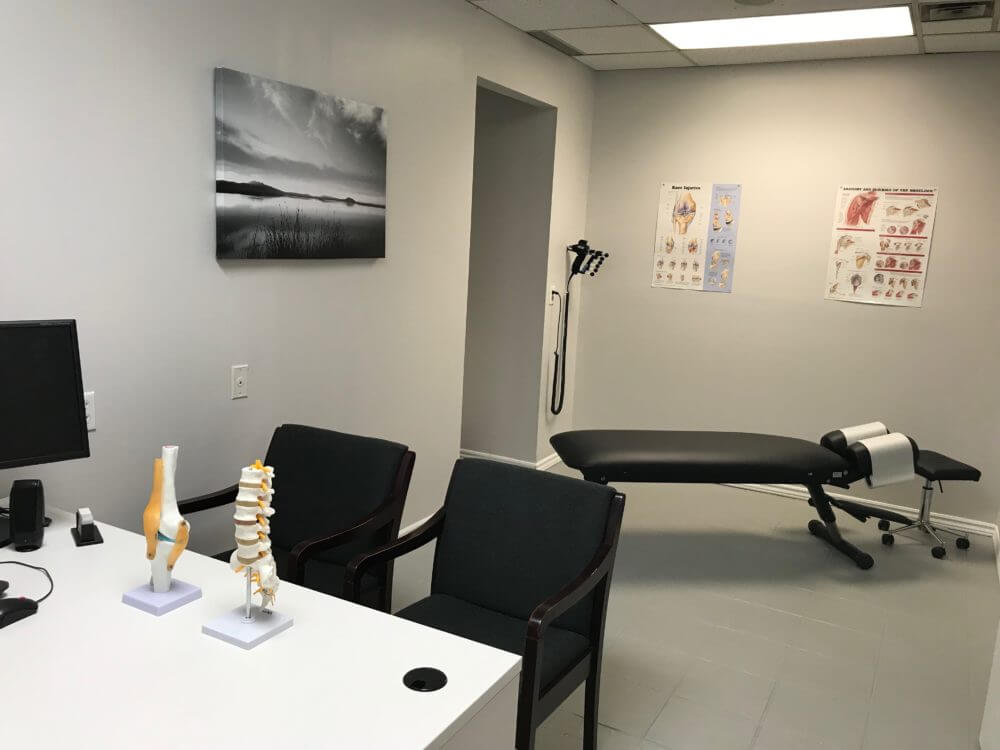 The chiropractic office at Runway Health which includes a consultation and treatment area.
