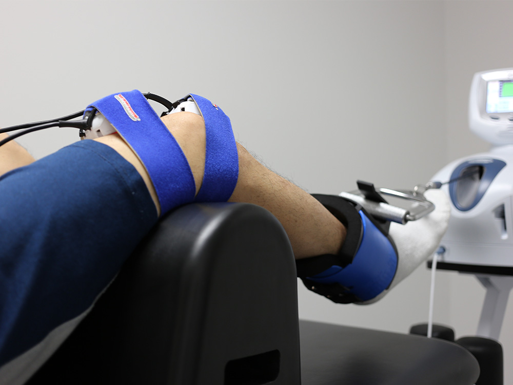 A male patient getting laser knee decompression on his right knee to help with symptoms of knee arthritis.